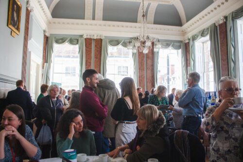A group of people stood in a room